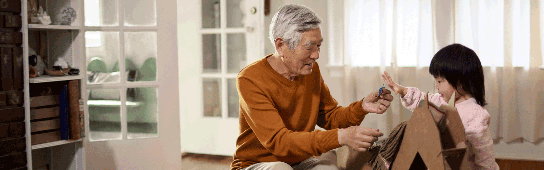 Grandfather playing with granddaughter
