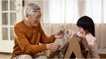 Grandfather playing with granddaughter